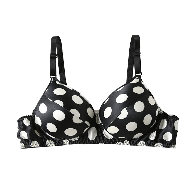 Black bra with white polka dots and adjustable straps.
