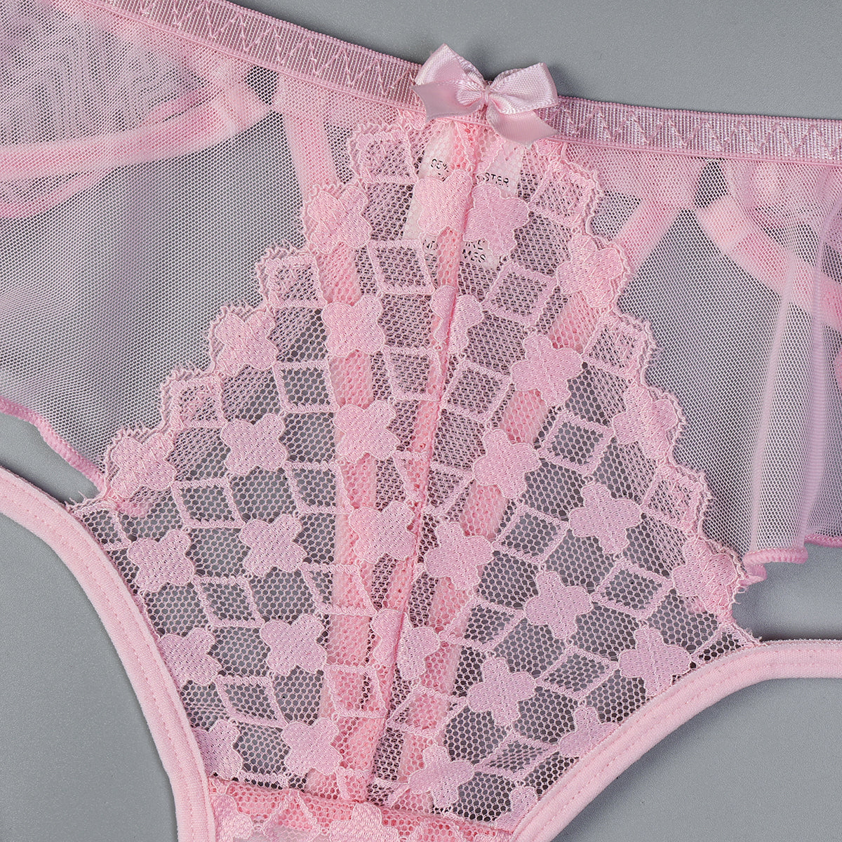 Three-piece lingerie set featuring embroidered