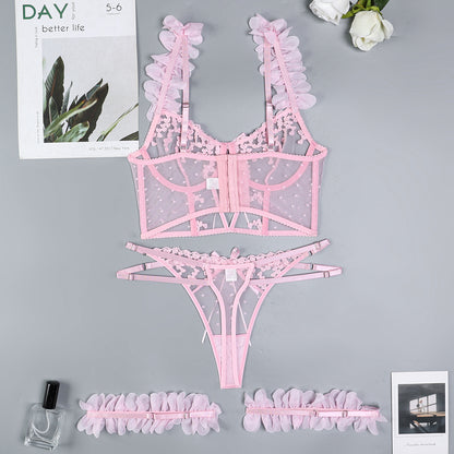 Pink three-piece lingerie set with embroidered design