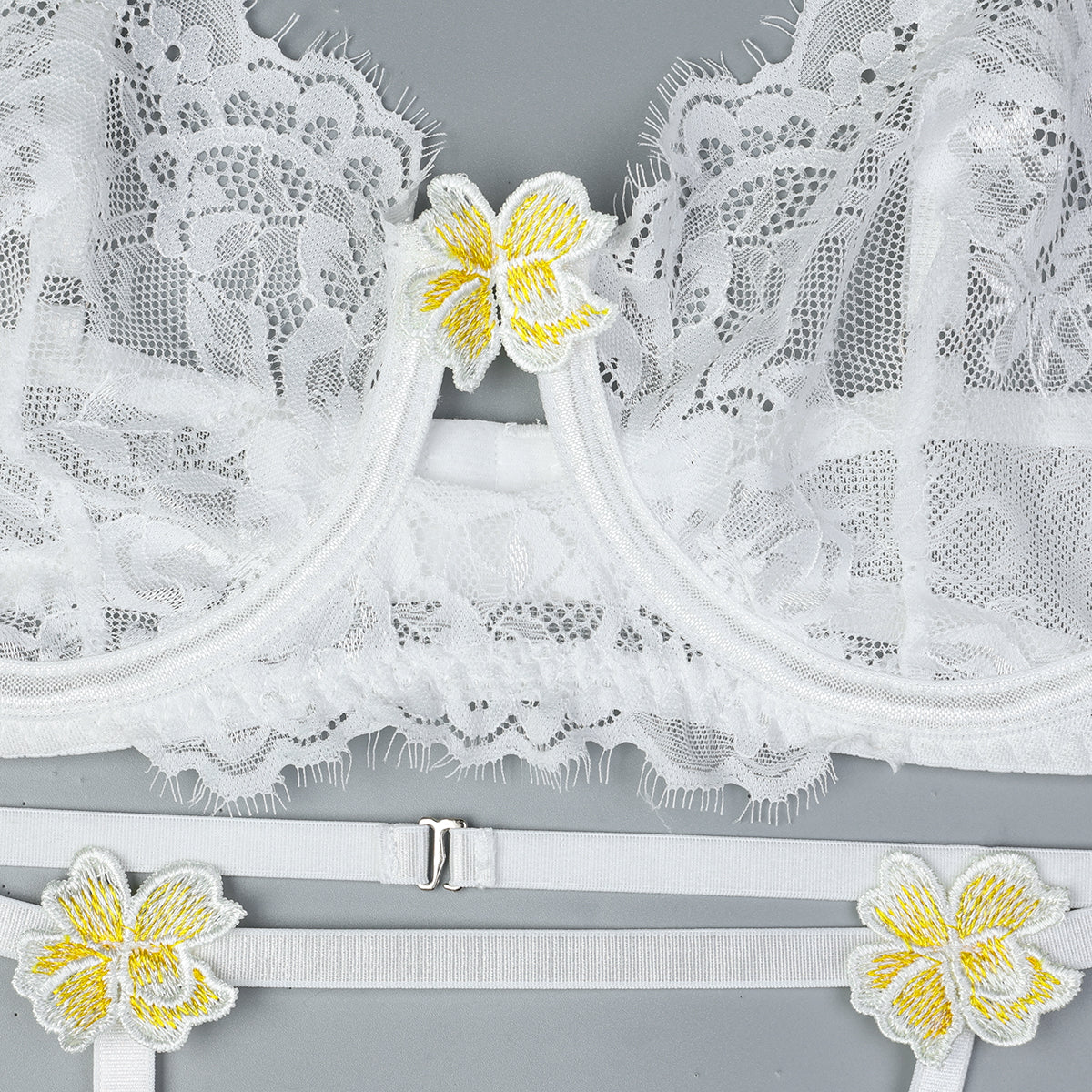 Garter straps design on three-piece lingerie set