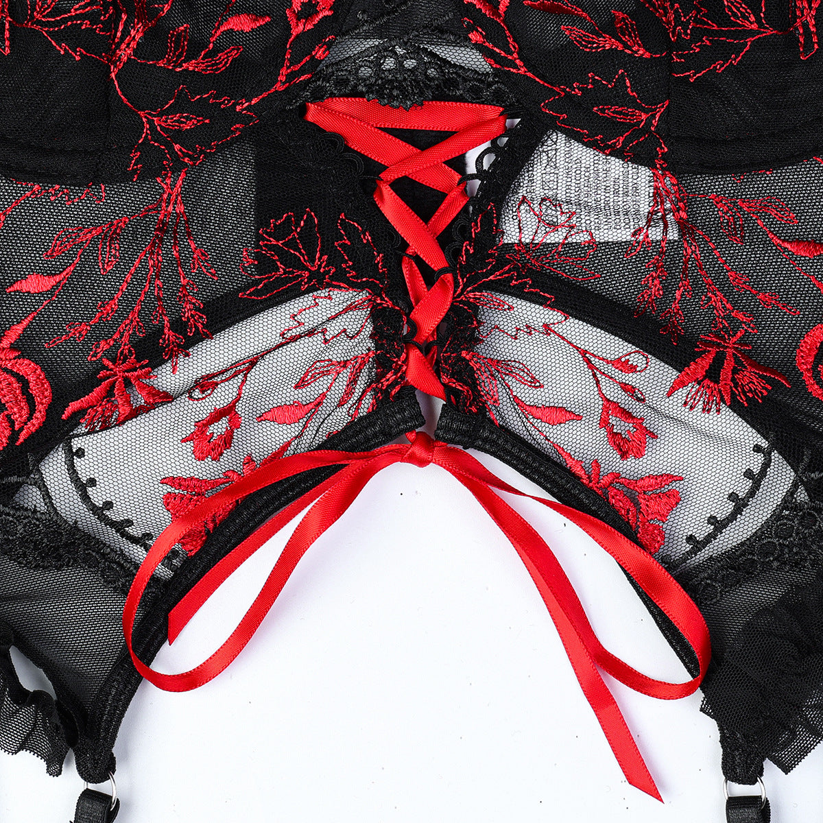 Red three-piece lingerie set featuring embroidered