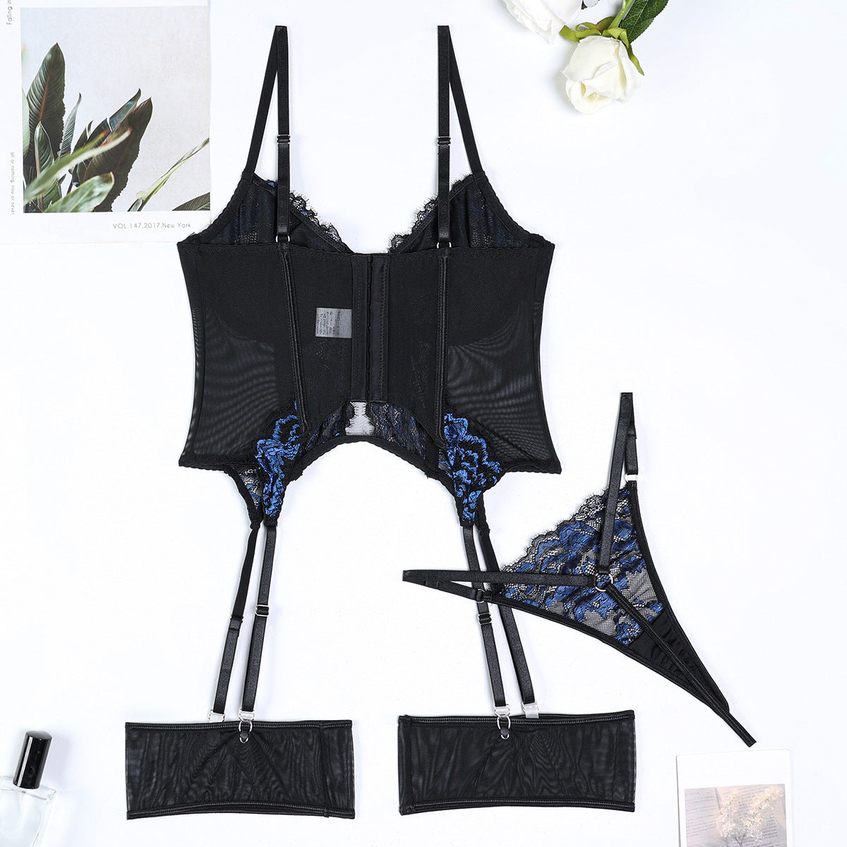 Cutout accents on black three-piece lingerie set