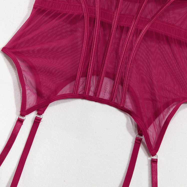 Strappy accents on red lingerie bodysuit
