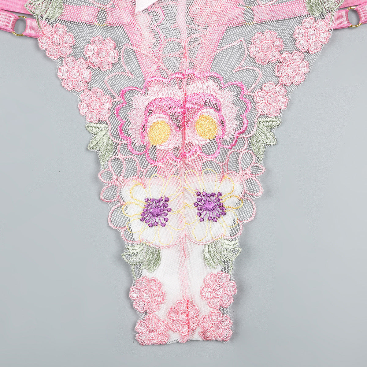 Pink bra and panty set featuring sheer mesh