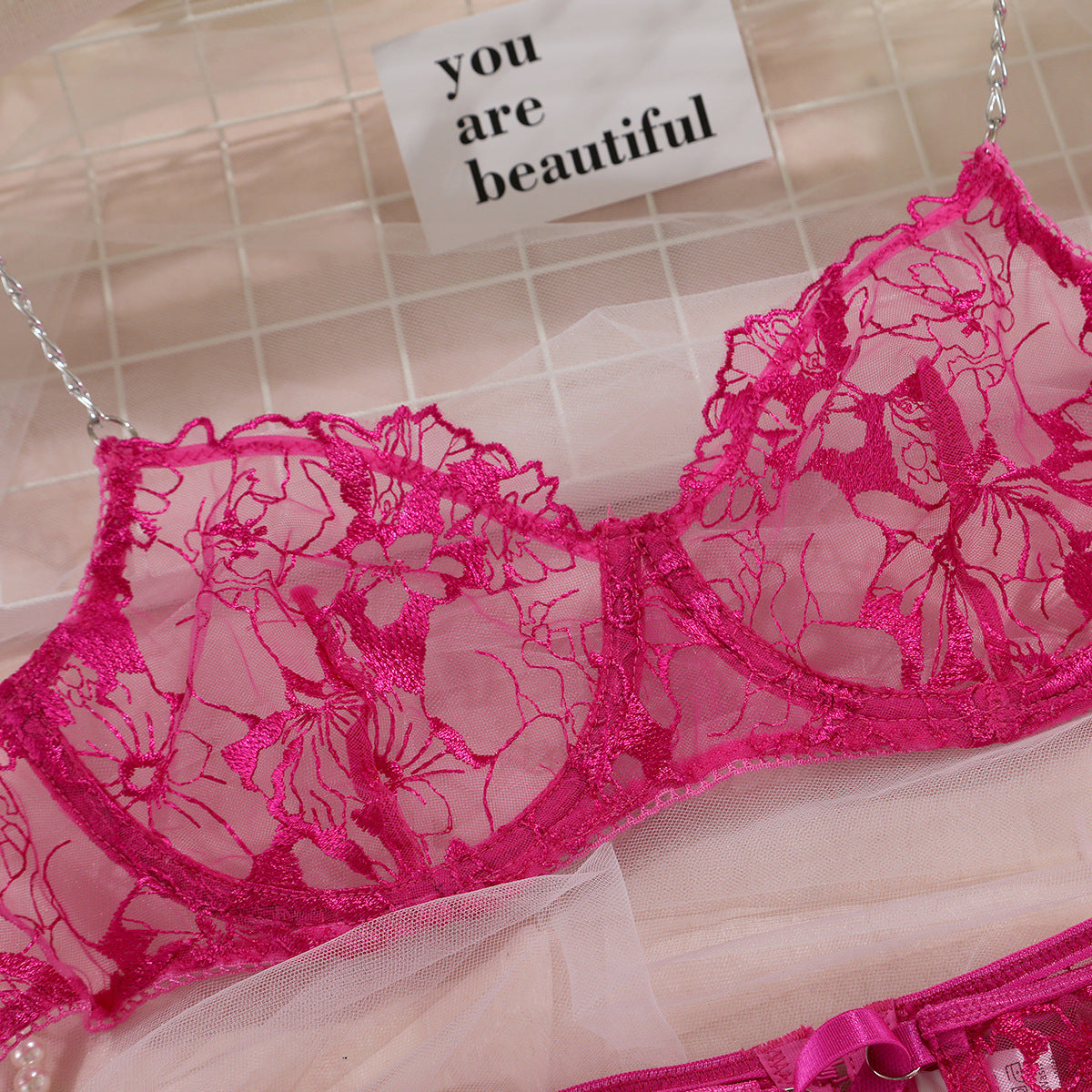 Four-piece lingerie set with floral details