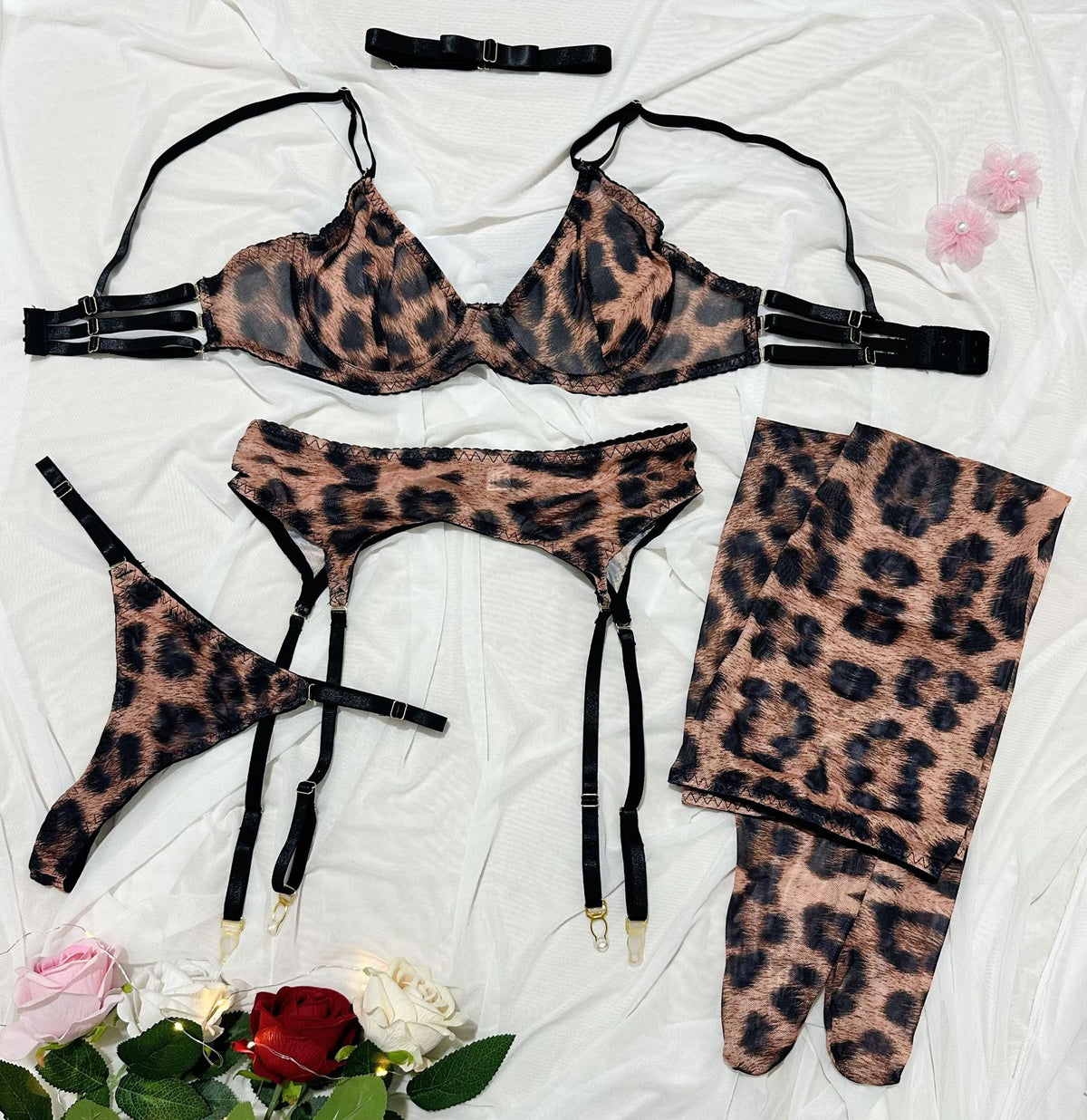 Five-piece lingerie set styled with harness