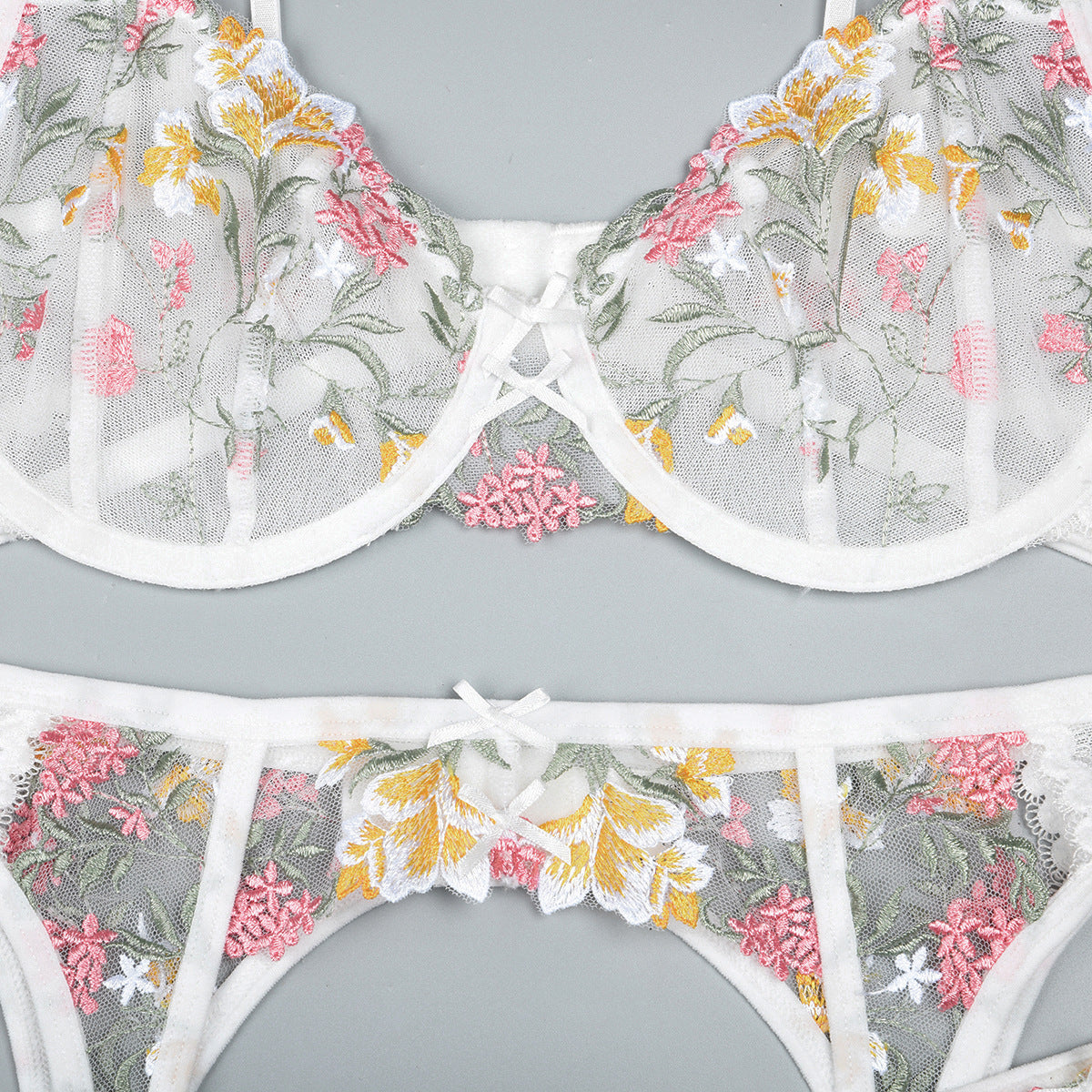 White three-piece lingerie set featuring underwire