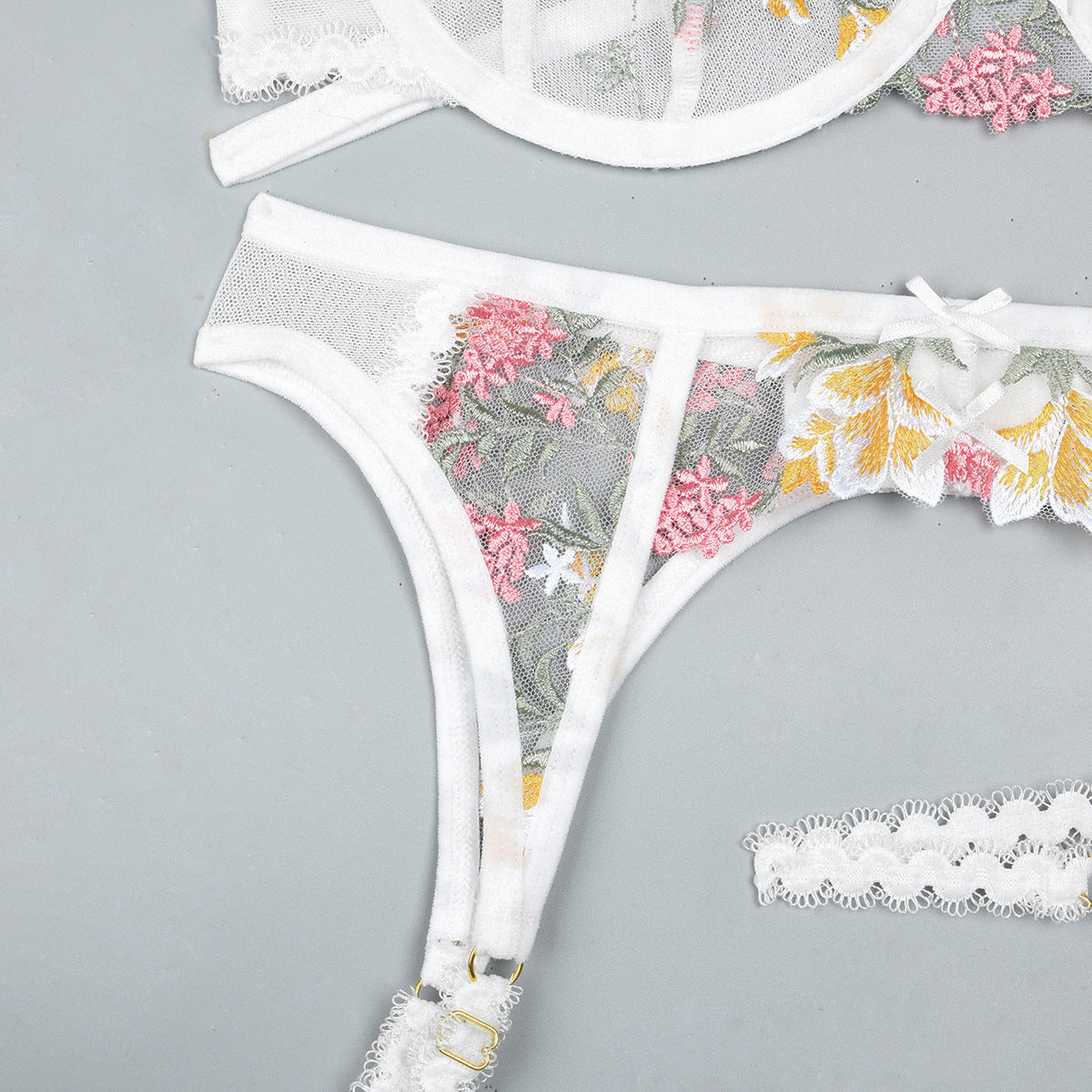White embroidered three-piece lingerie set