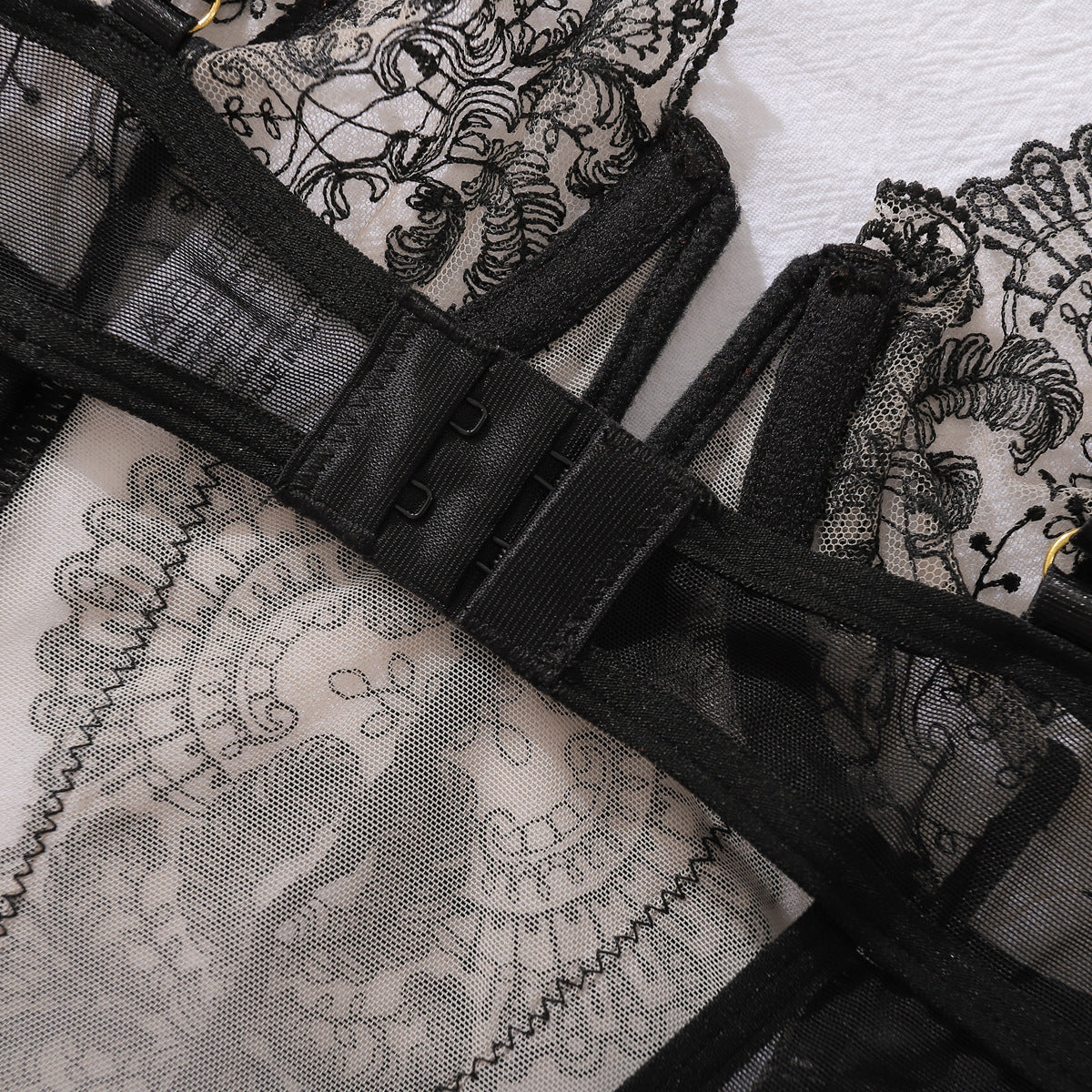 Sheer mesh design on three-piece lingerie set