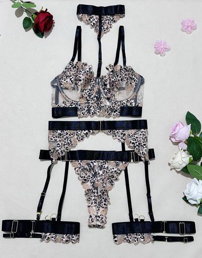 Harness accents on five-piece lingerie set