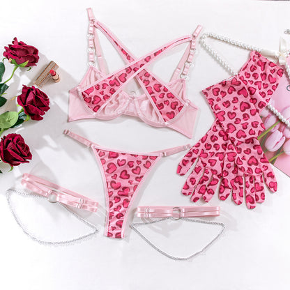 Harness accents on five-piece lingerie set