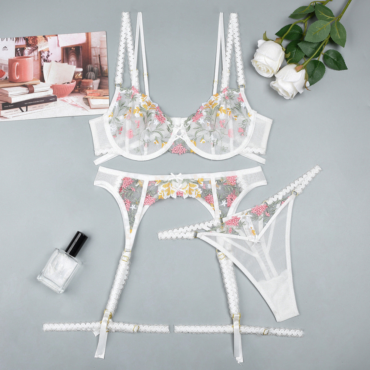 White three-piece lingerie set with lace design