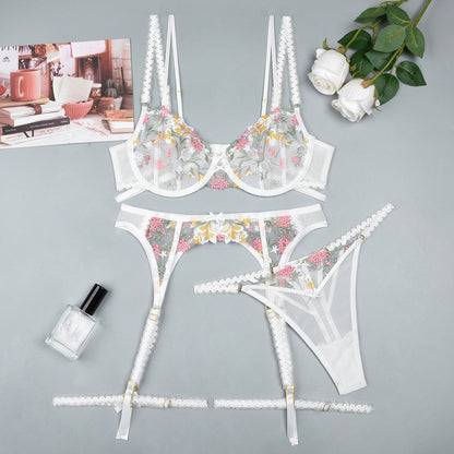 White three-piece lingerie set with lace design