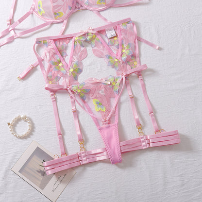 Pink four-piece lingerie set featuring embroidered