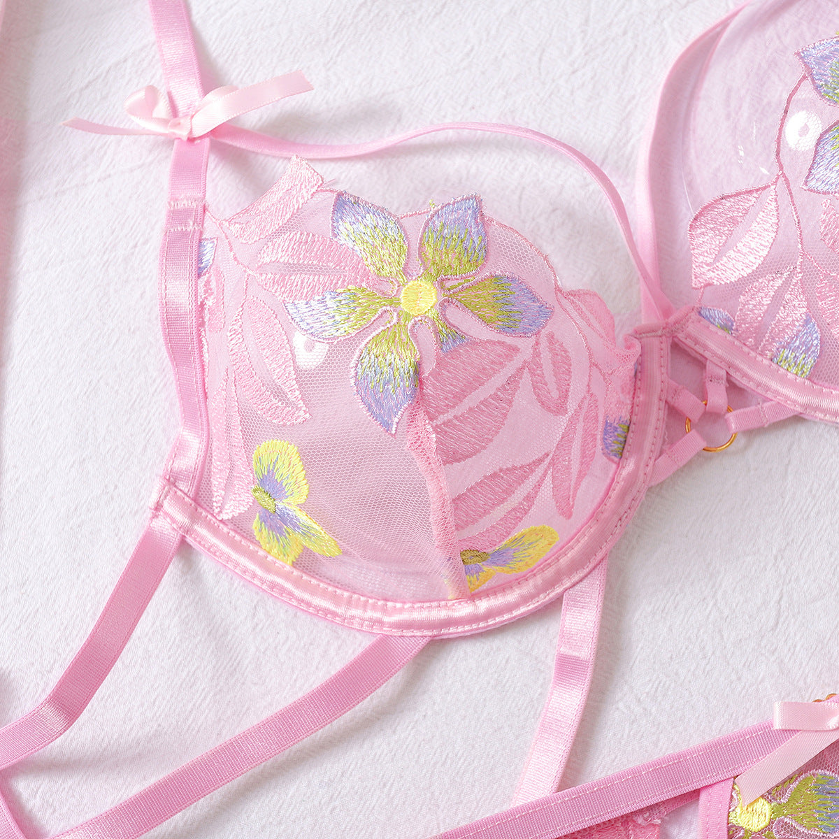 Pink strappy detailed four-piece lingerie set