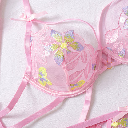 Pink strappy detailed four-piece lingerie set