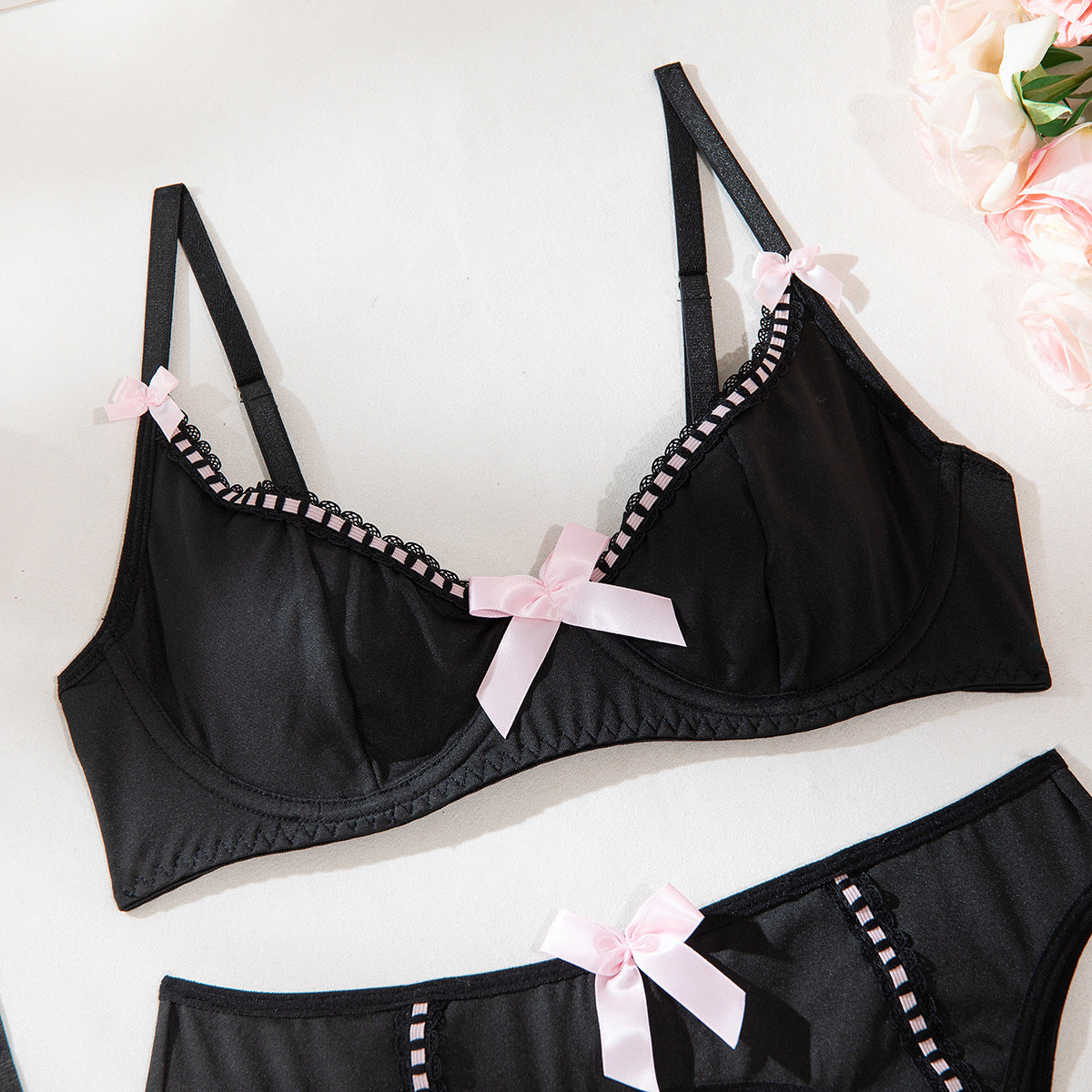Satin design on four-piece lingerie set
