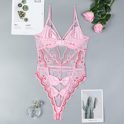 Bow accents on pink lingerie bodysuit