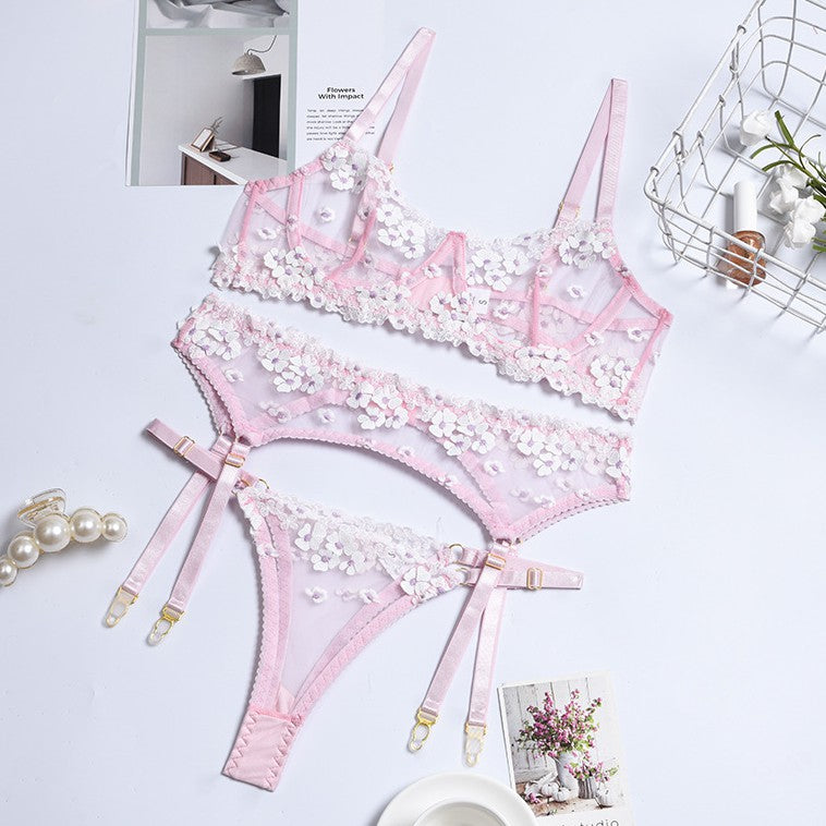 Sheer mesh accents on three-piece lingerie set