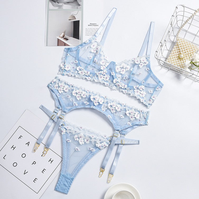 Three-piece lingerie set styled with floral embroidered