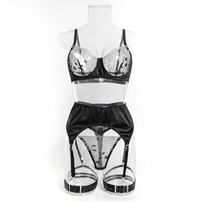 Sheer mesh accents on four-piece lingerie set