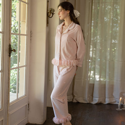 Side view of the blush pink button cardigan and matching ruffle-hem pajama pants