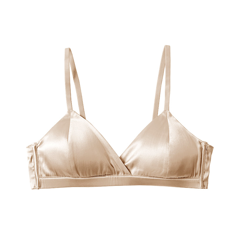 Nude silk bra with adjustable straps.