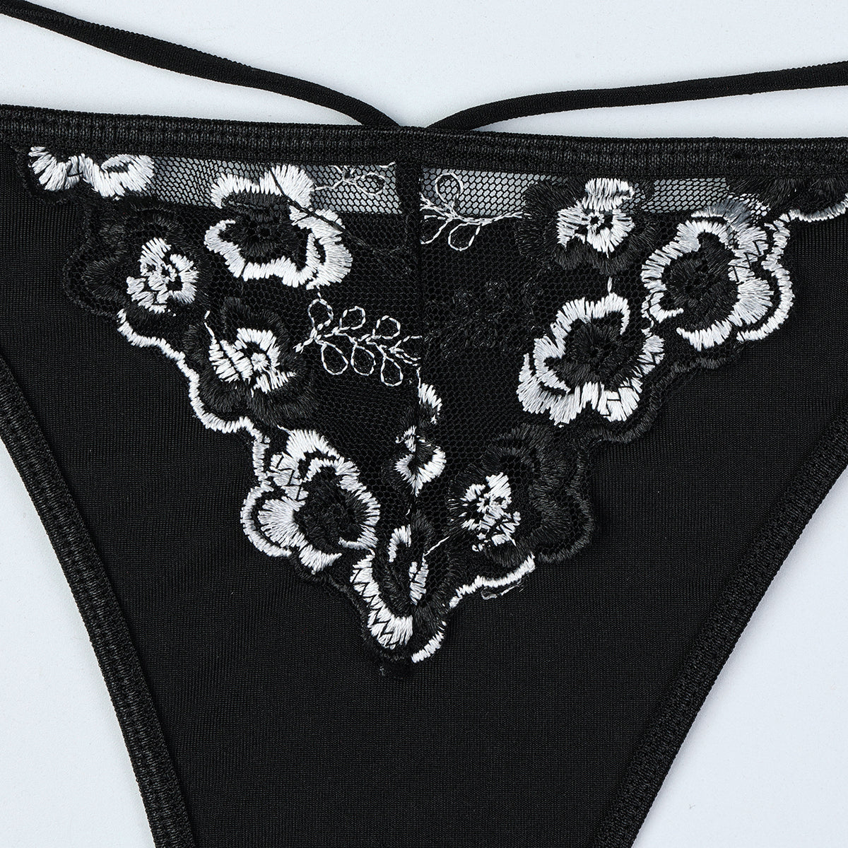 Black bra and panty set featuring floral
