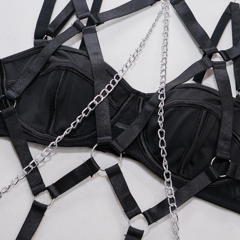Black four-piece lingerie set with sheer mesh design