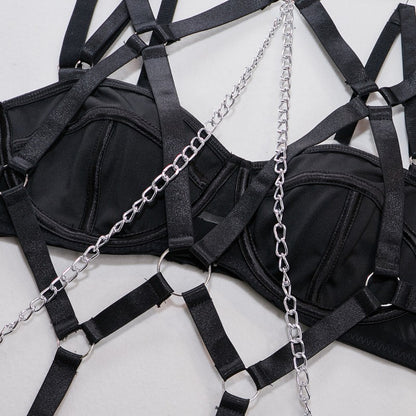 Black four-piece lingerie set with sheer mesh design