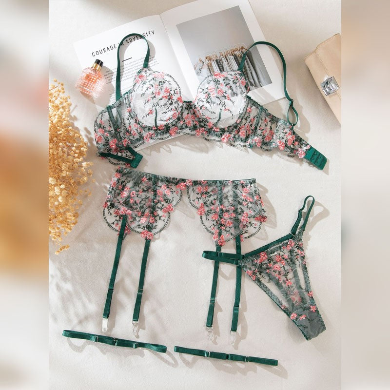 Green four-piece lingerie set with floral embroidered design