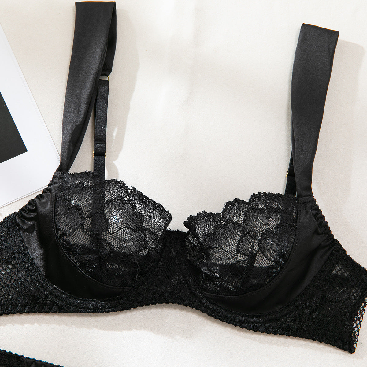 Lace accents on black three-piece lingerie set