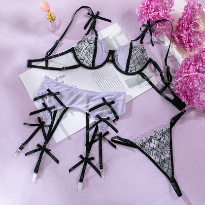 Bow accents on purple three-piece lingerie set