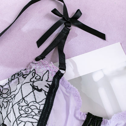 Purple three-piece lingerie set featuring sheer mesh
