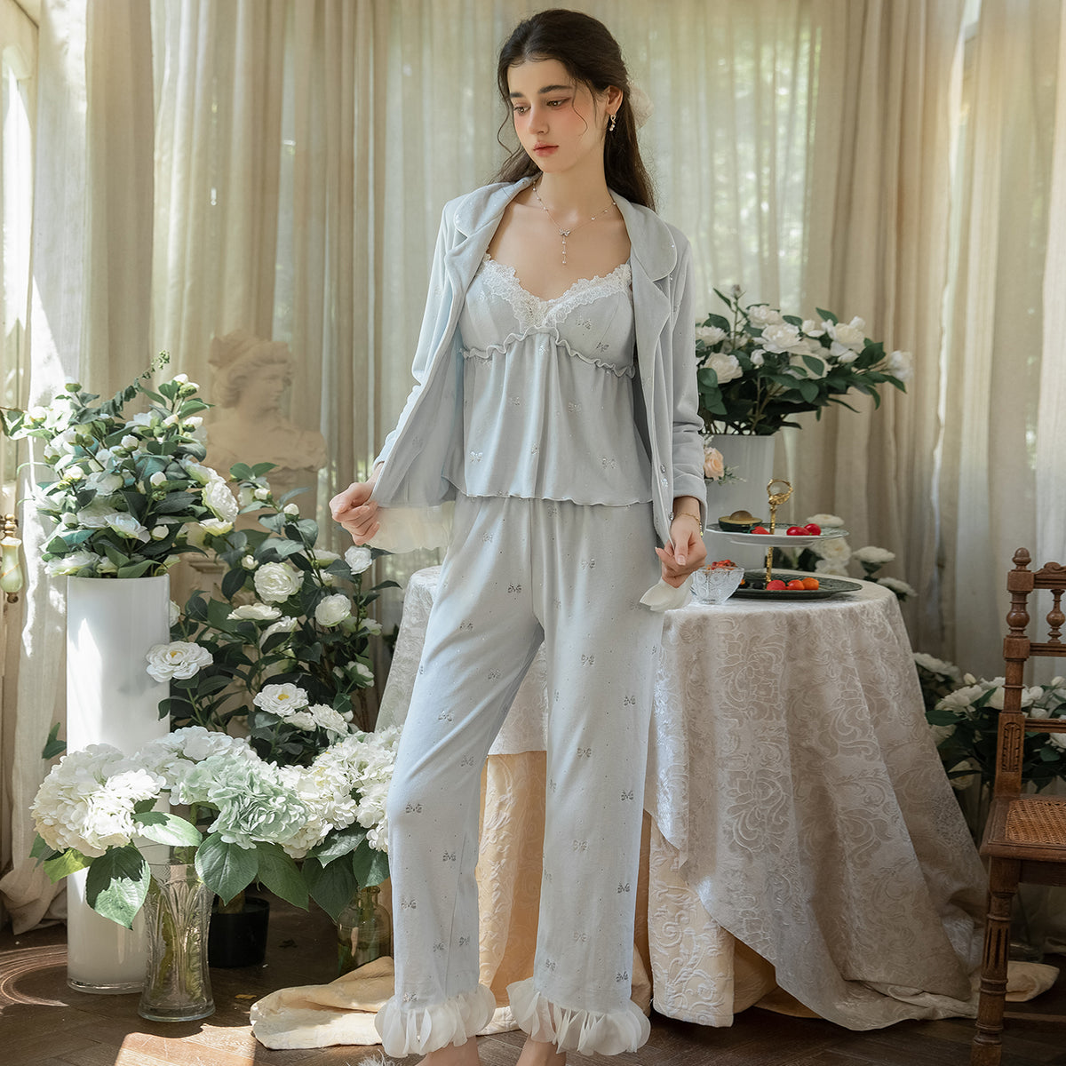 Full view of the light blue floral 3-piece pajama set with cardigan worn open