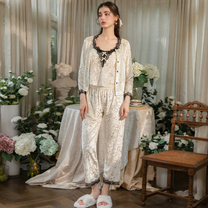 Model wearing the buttoned light yellow cardigan with matching lace-trim pajama pants