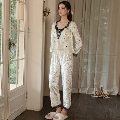 Light yellow floral-textured cardigan and long pajama pants shown beside a window