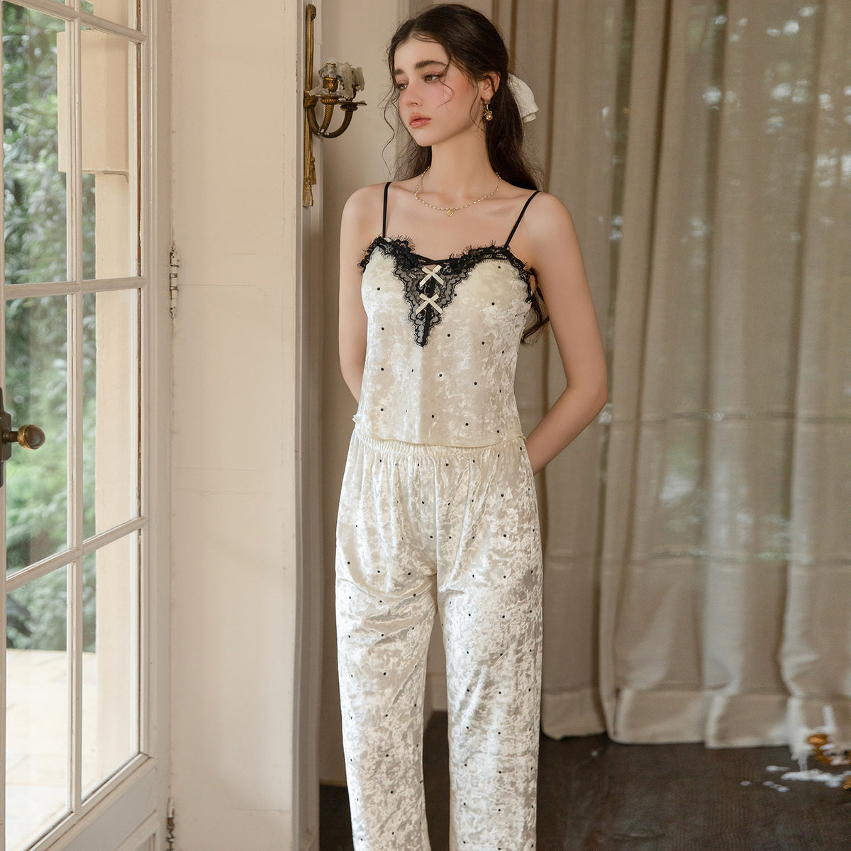 Front view of the light yellow lace-trim camisole and matching long pajama pants
