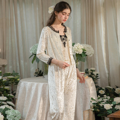 Front view of the light yellow pajama set with black lace-trim button cardigan and long pants