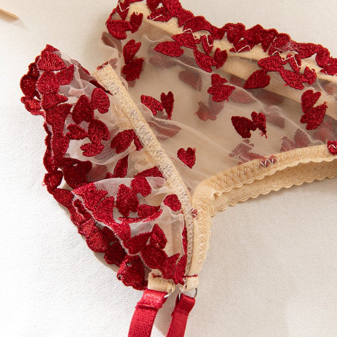 Three-piece lingerie set styled with sheer mesh